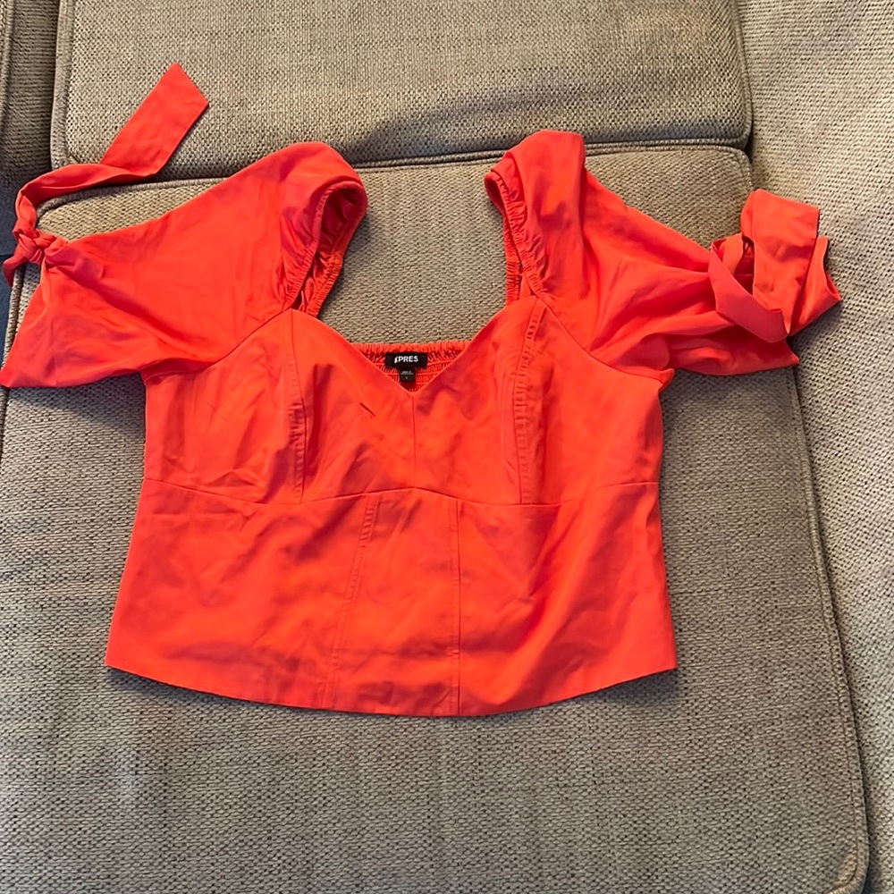 Bright orange off the shoulder blouse